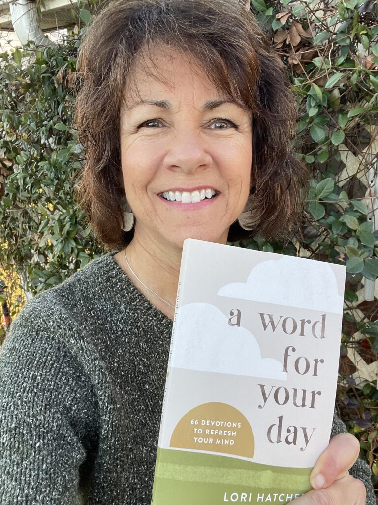 Lori Hatcher holding a copy of A Word for Your Day